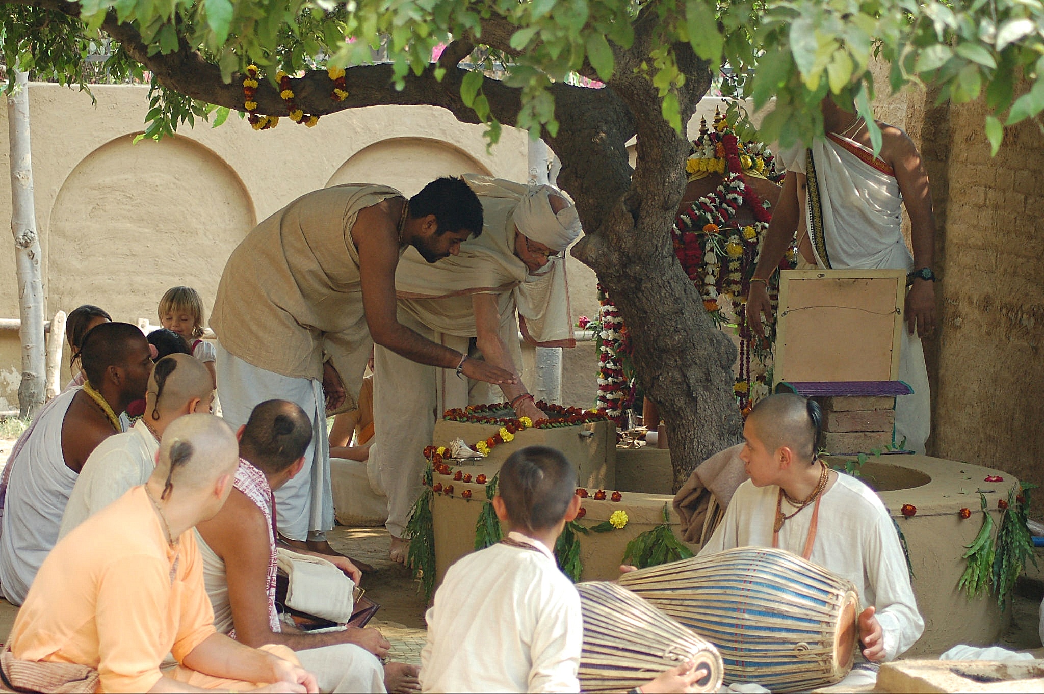 Devotees at a courtyard festival