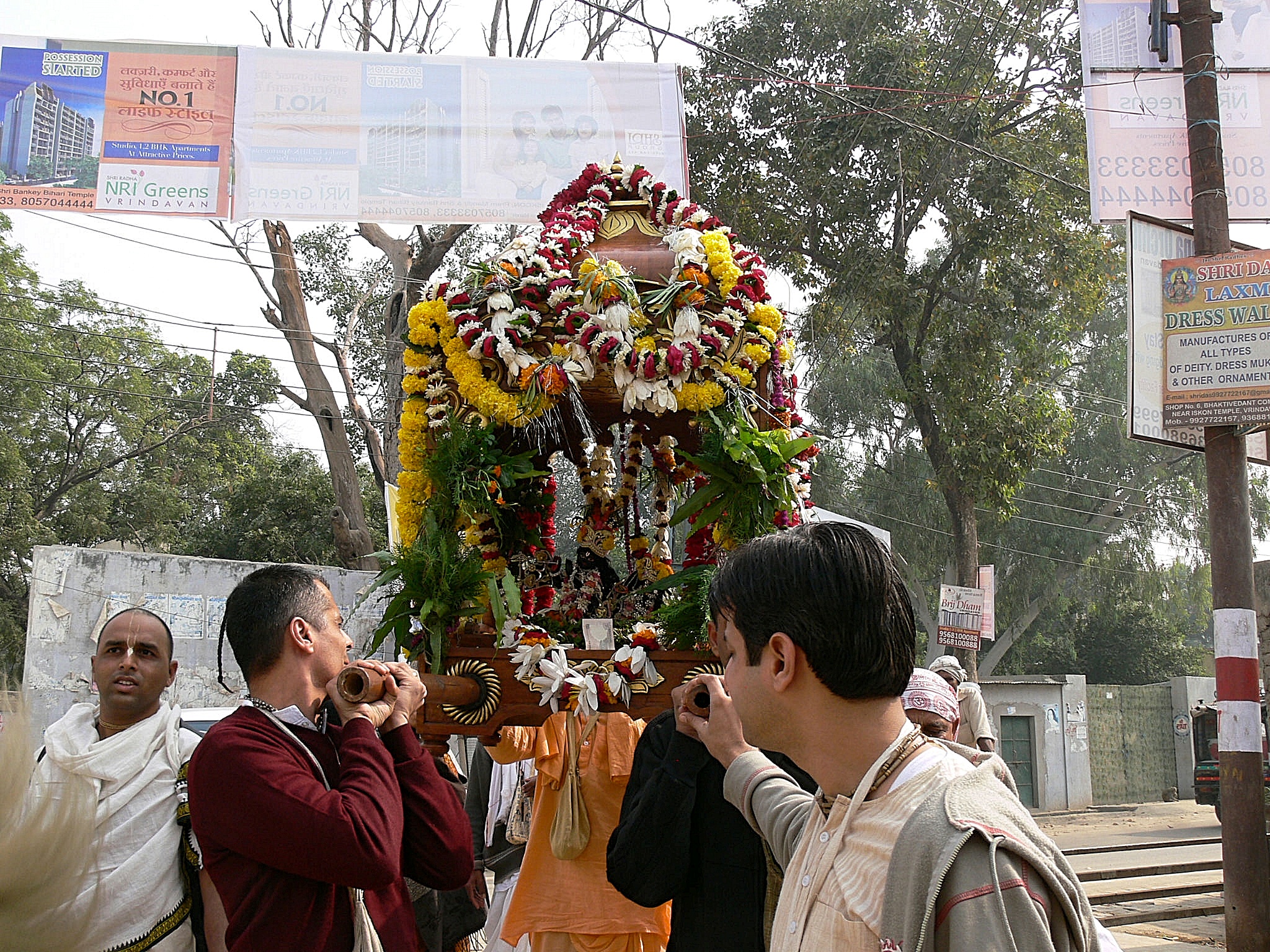 Radha Madhava carried to a courtyard festival